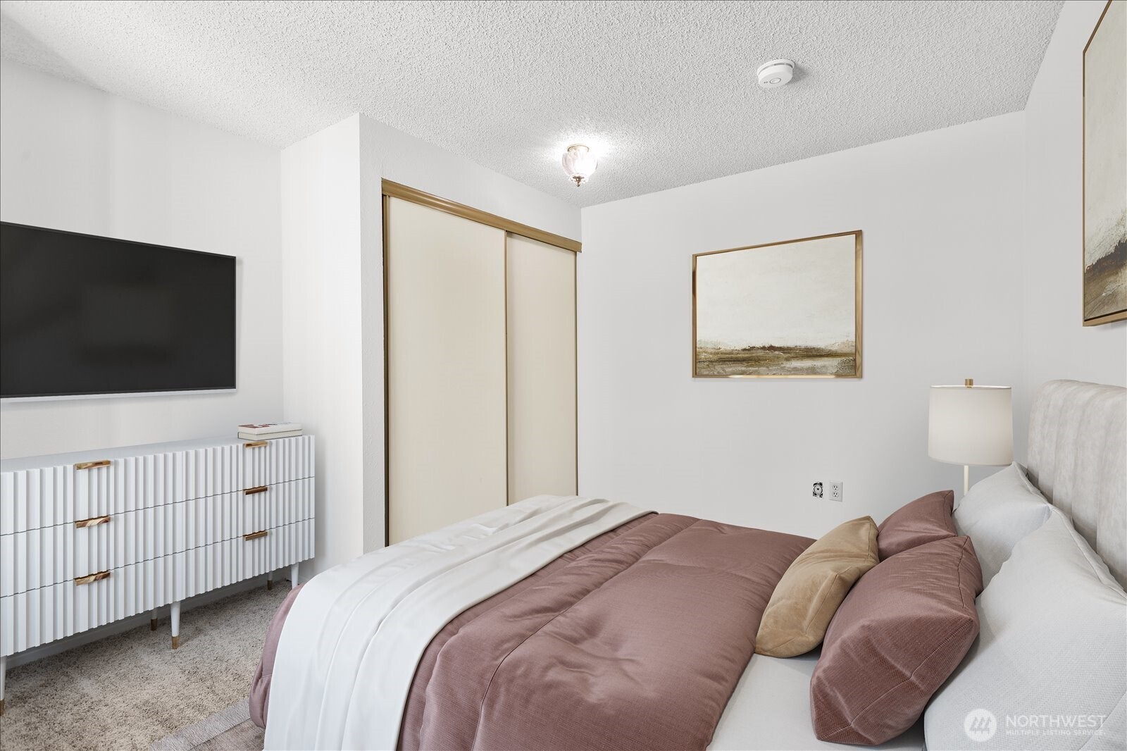 15914 3rd Place Southwest, Unit C Burien, WA 98166 - Photo 17 of 34 a bedroom with a bed and a flat screen tv