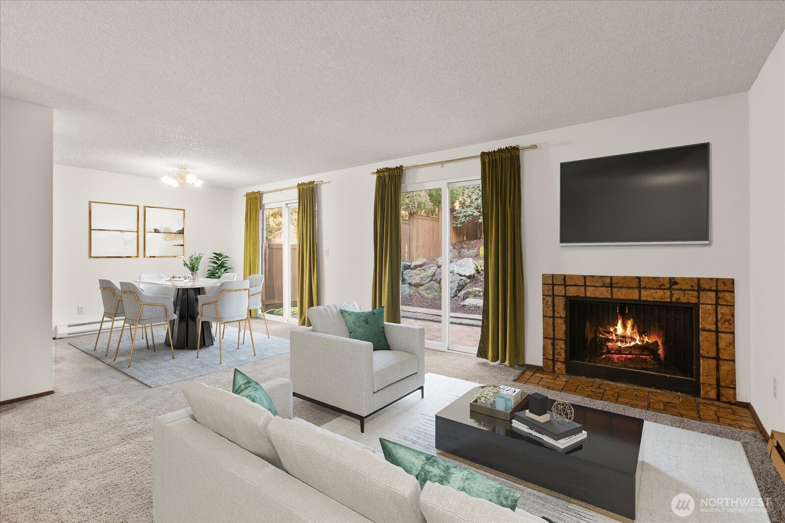 15914 3rd Place Southwest, Unit C Burien, WA 98166 - Photo 2 of 34 a living room with furniture a fireplace and a flat screen tv
