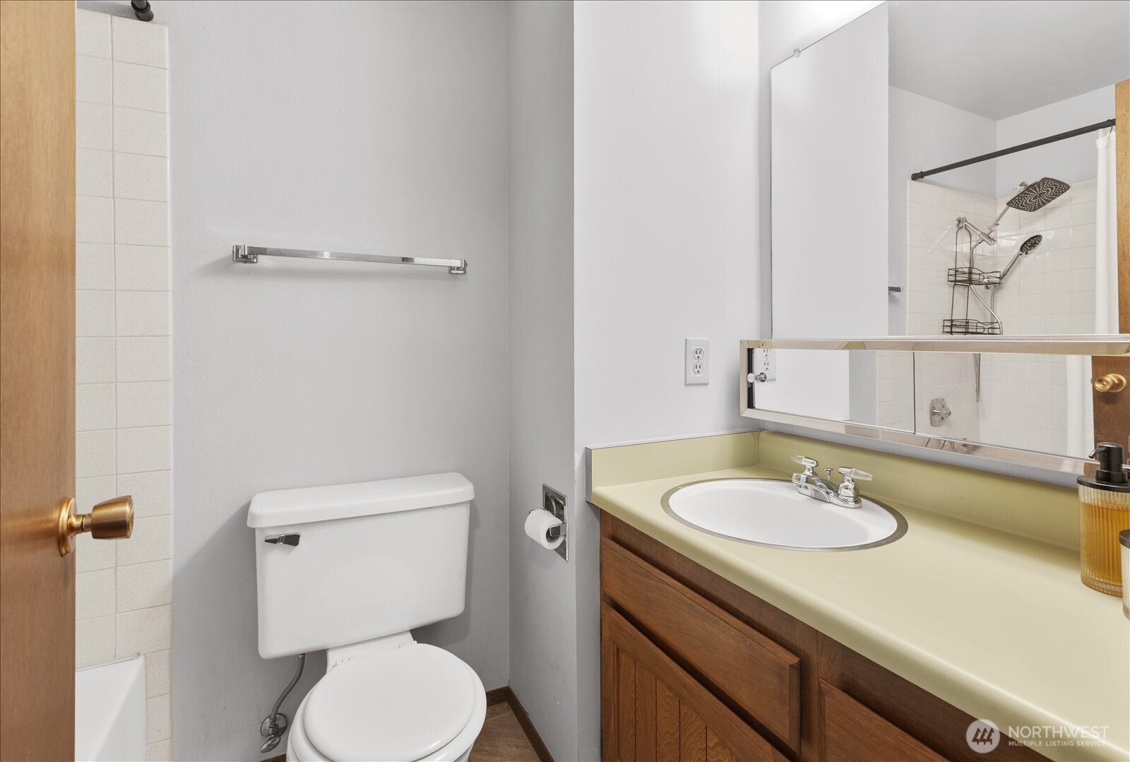 15914 3rd Place Southwest, Unit C Burien, WA 98166 - Photo 21 of 34 a bathroom with a granite countertop sink toilet and a mirror