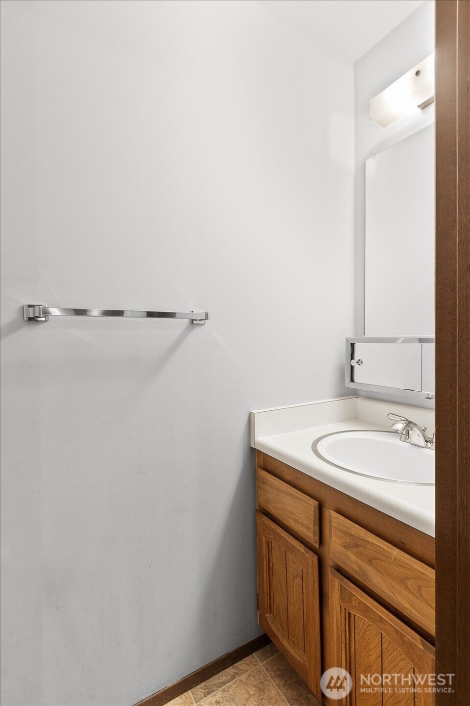 15914 3rd Place Southwest, Unit C Burien, WA 98166 - Photo 22 of 34 a bathroom with a sink and vanity