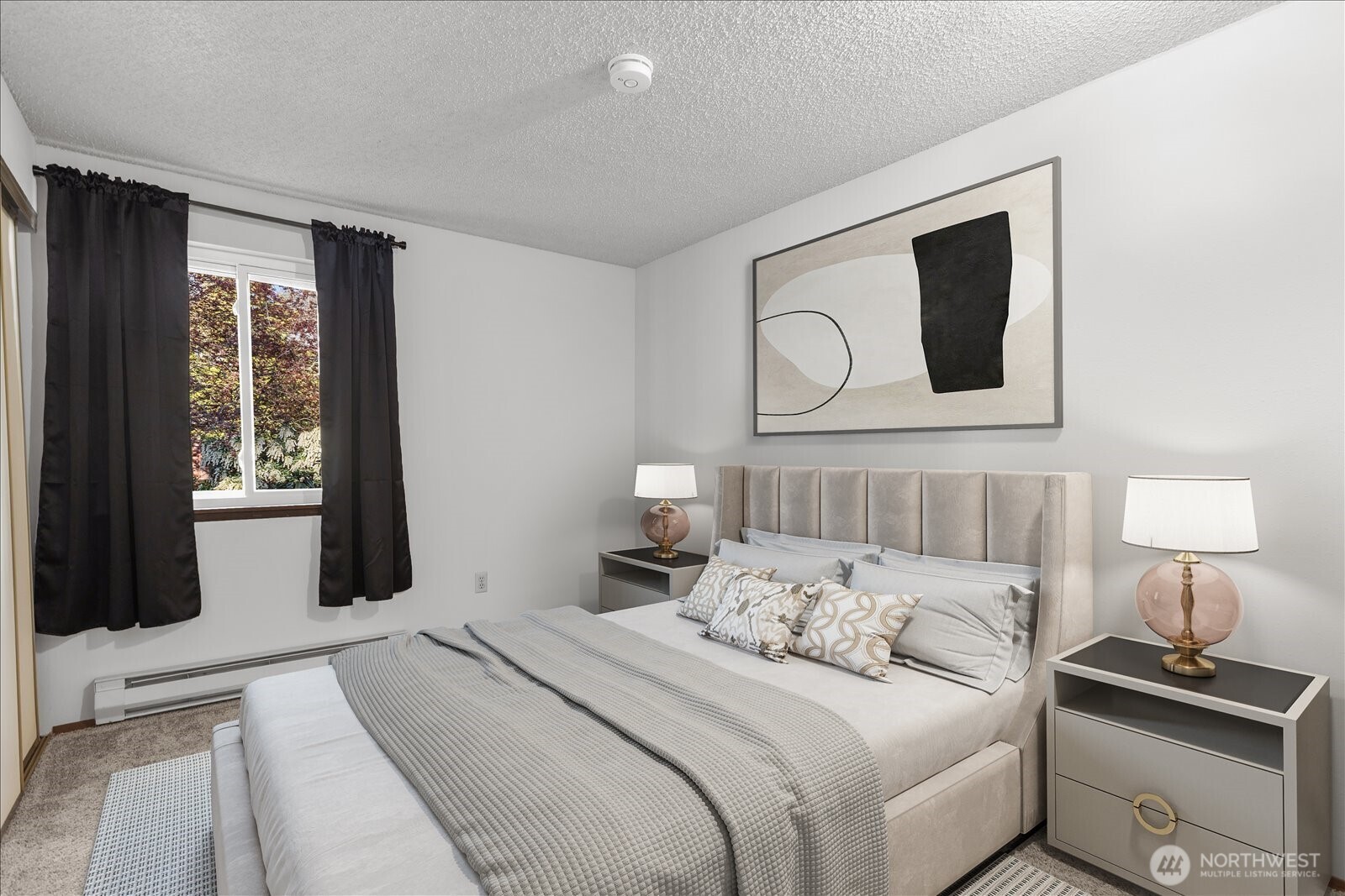 15914 3rd Place Southwest, Unit C Burien, WA 98166 - Photo 23 of 34 a bedroom with a bed and a lamp