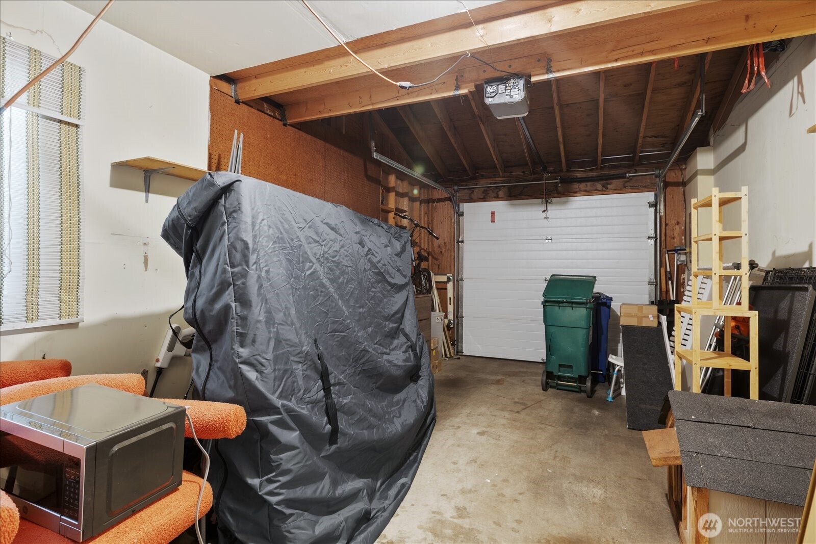 15914 3rd Place Southwest, Unit C Burien, WA 98166 - Photo 27 of 34 a view of walk in closet with clothes and shoes