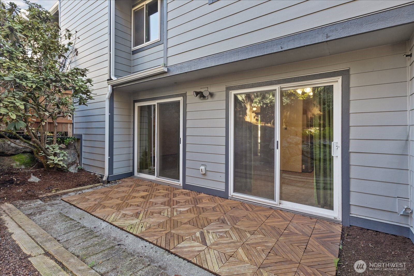 15914 3rd Place Southwest, Unit C Burien, WA 98166 - Photo 28 of 34 a view of a house with a backyard and balcony