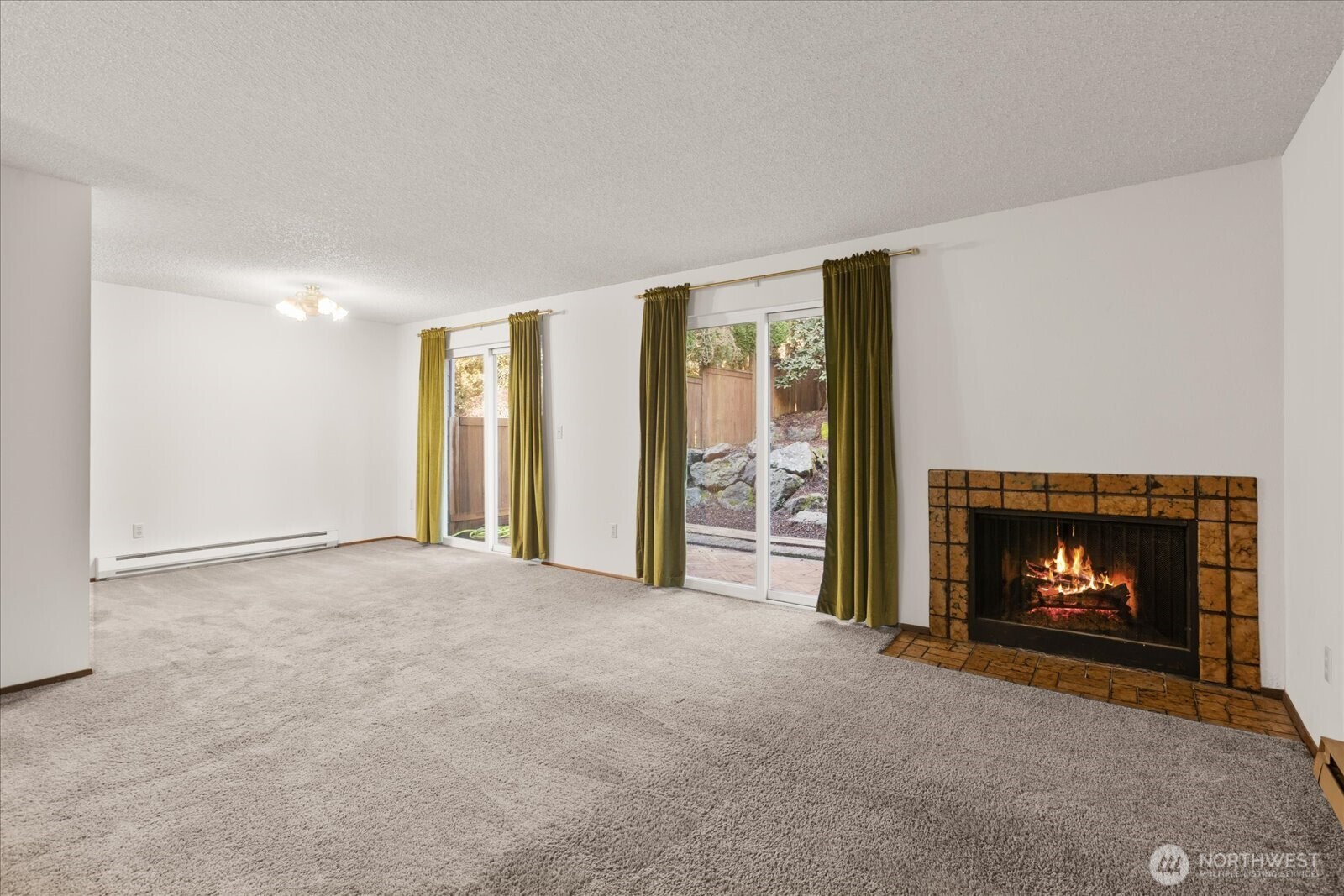 15914 3rd Place Southwest, Unit C Burien, WA 98166 - Photo 3 of 34 a view of empty room with a fireplace