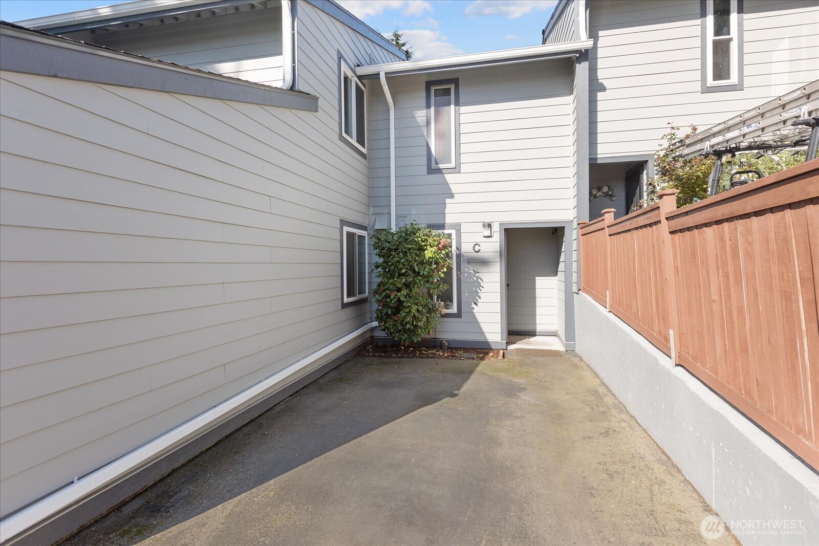 15914 3rd Place Southwest, Unit C Burien, WA 98166 - Photo 33 of 34 a view of a house with a garage