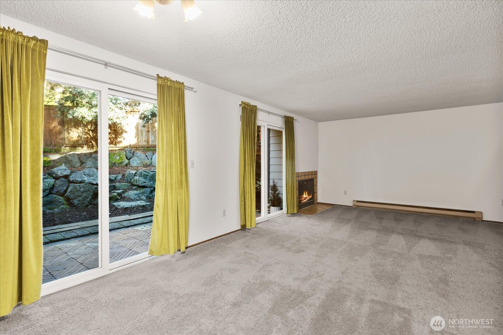 15914 3rd Place Southwest, Unit C Burien, WA 98166 - Photo 4 of 34 a view of an empty room with glass door