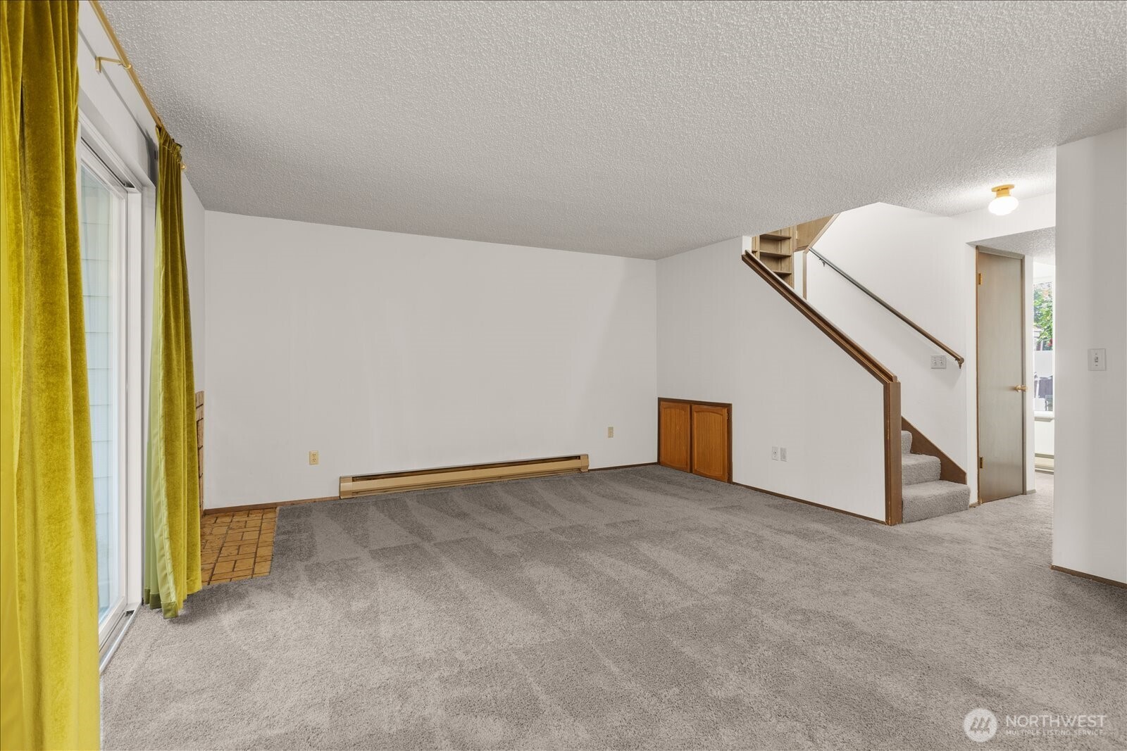 15914 3rd Place Southwest, Unit C Burien, WA 98166 - Photo 5 of 34 a view of an empty room with stairs