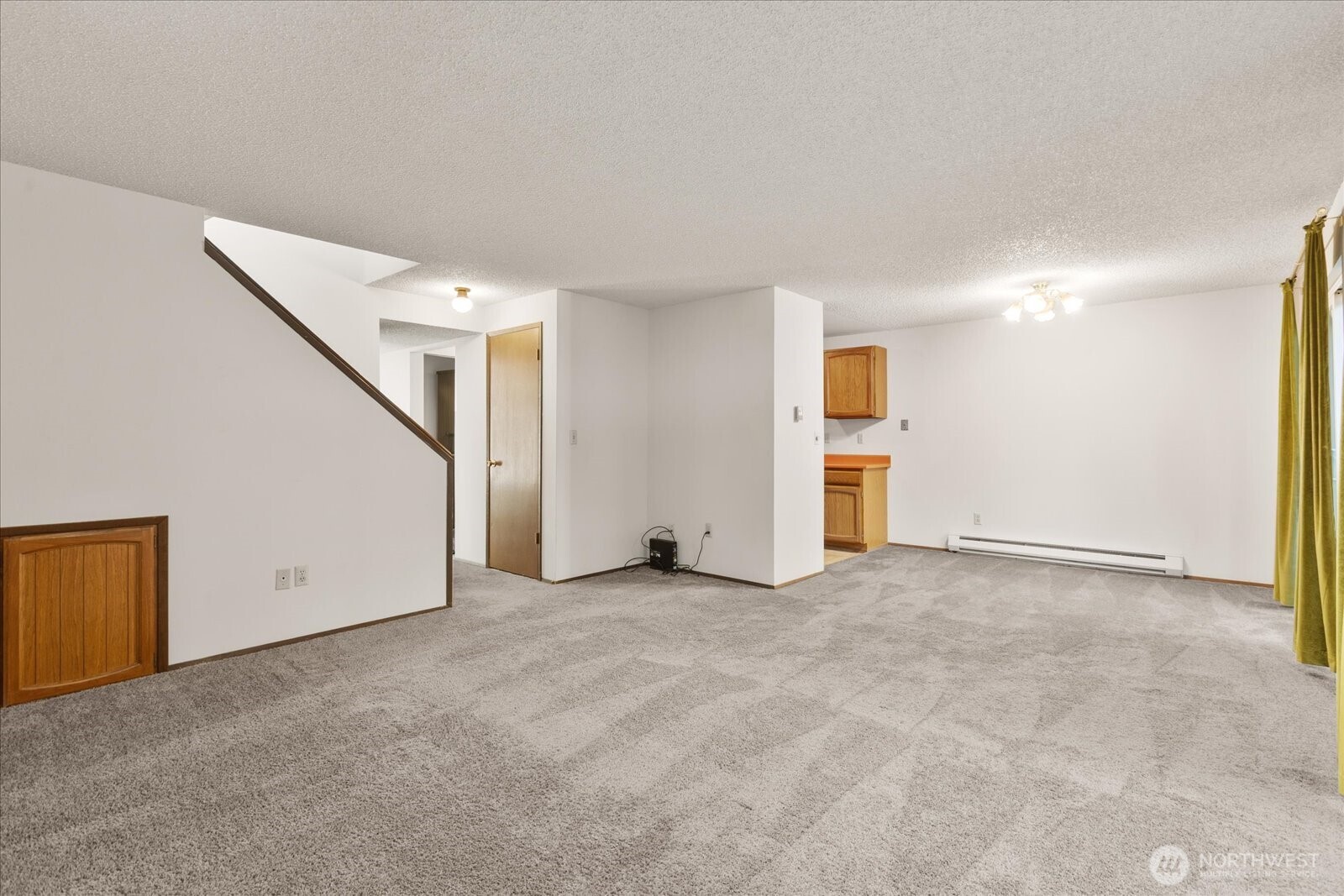 15914 3rd Place Southwest, Unit C Burien, WA 98166 - Photo 7 of 34 an empty room with windows