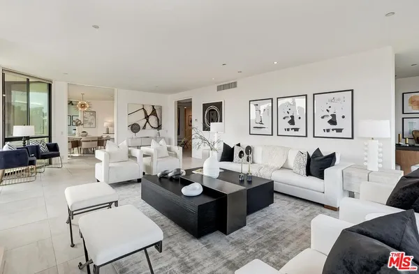 a living room with furniture granite and a couch