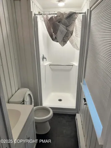 a bathroom with a toilet and a sink