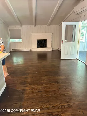 a view of kitchen with wooden floor