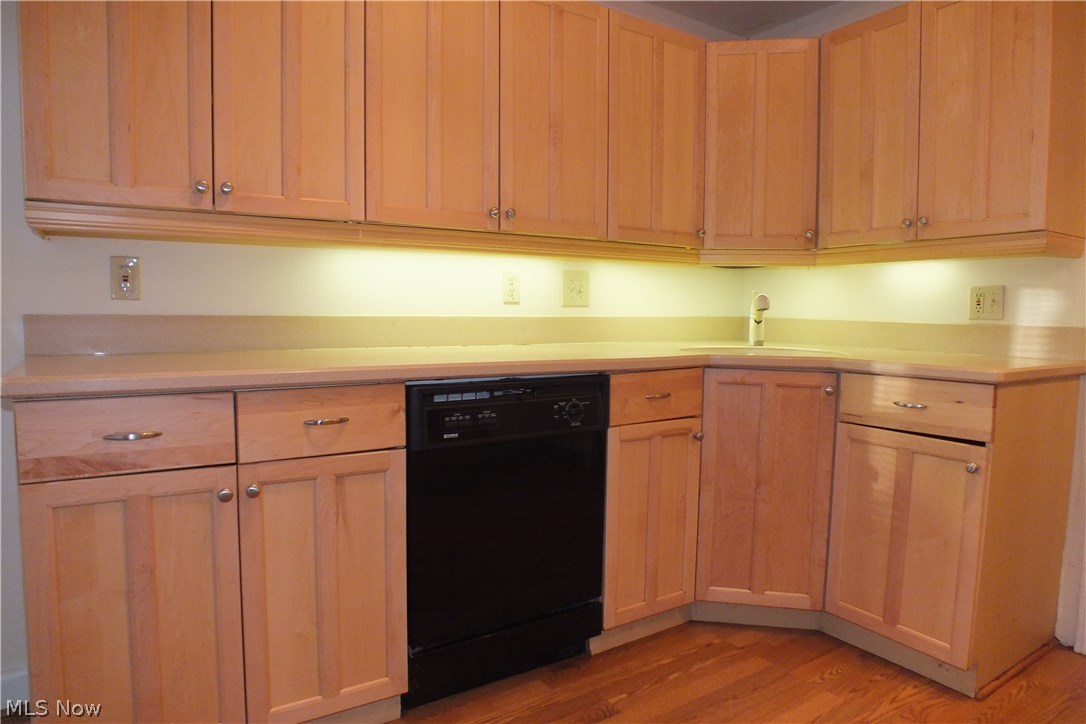 3844 Bethany Road Cleveland, OH 44118 - Photo 12 of 35 The kitchen has a hardwood-like laminate flooring and plenty of newer cabinets for great storage space