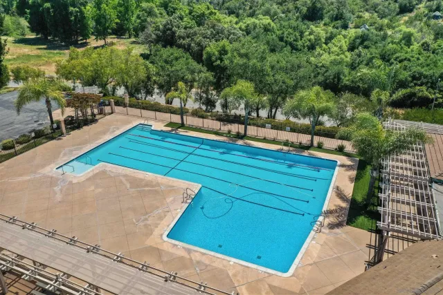 a view of a backyard with sitting area