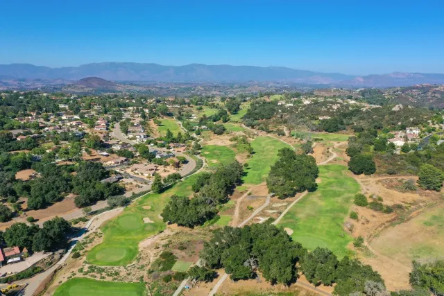 a view of a city with mountains in the background