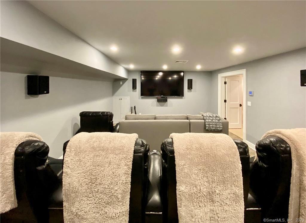 7 Whaling Road Darien, CT 06820 - Photo 26 of 34 a living room with furniture and a flat screen tv