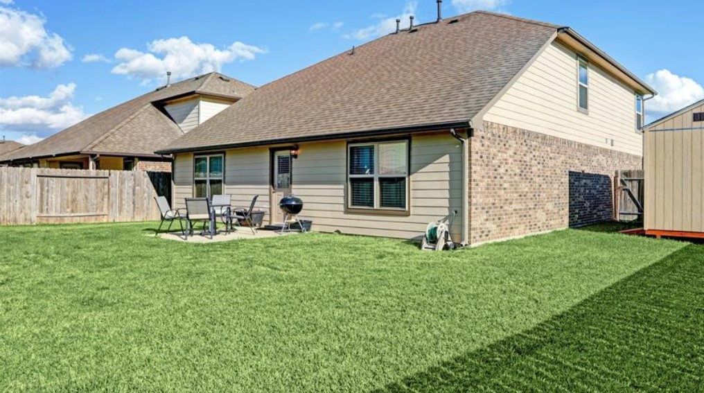 1 Rodeo Bend Drive Manvel, TX 77578 - Photo 21 of 22 a front view of a house with garden