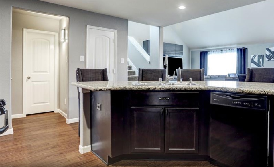 1 Rodeo Bend Drive Manvel, TX 77578 - Photo 6 of 22 a kitchen with stainless steel appliances granite countertop a sink and a stove