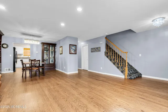 a view of dining room with furniture and wooden floor