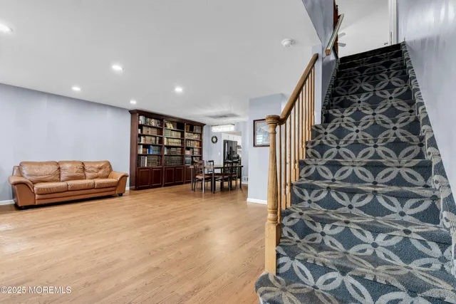 a view of livingroom with furniture and staircase