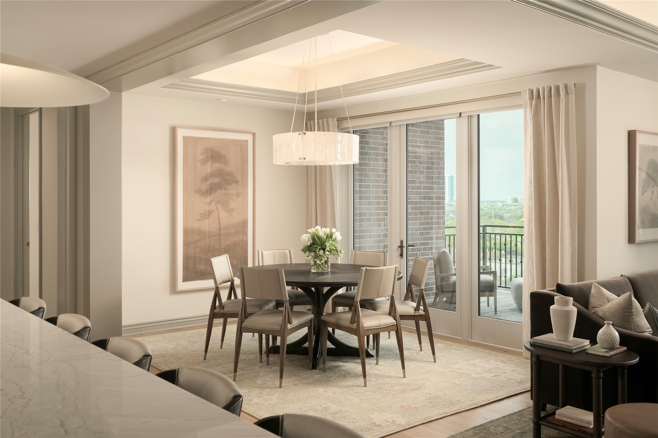 a view of a dining room with furniture and a window