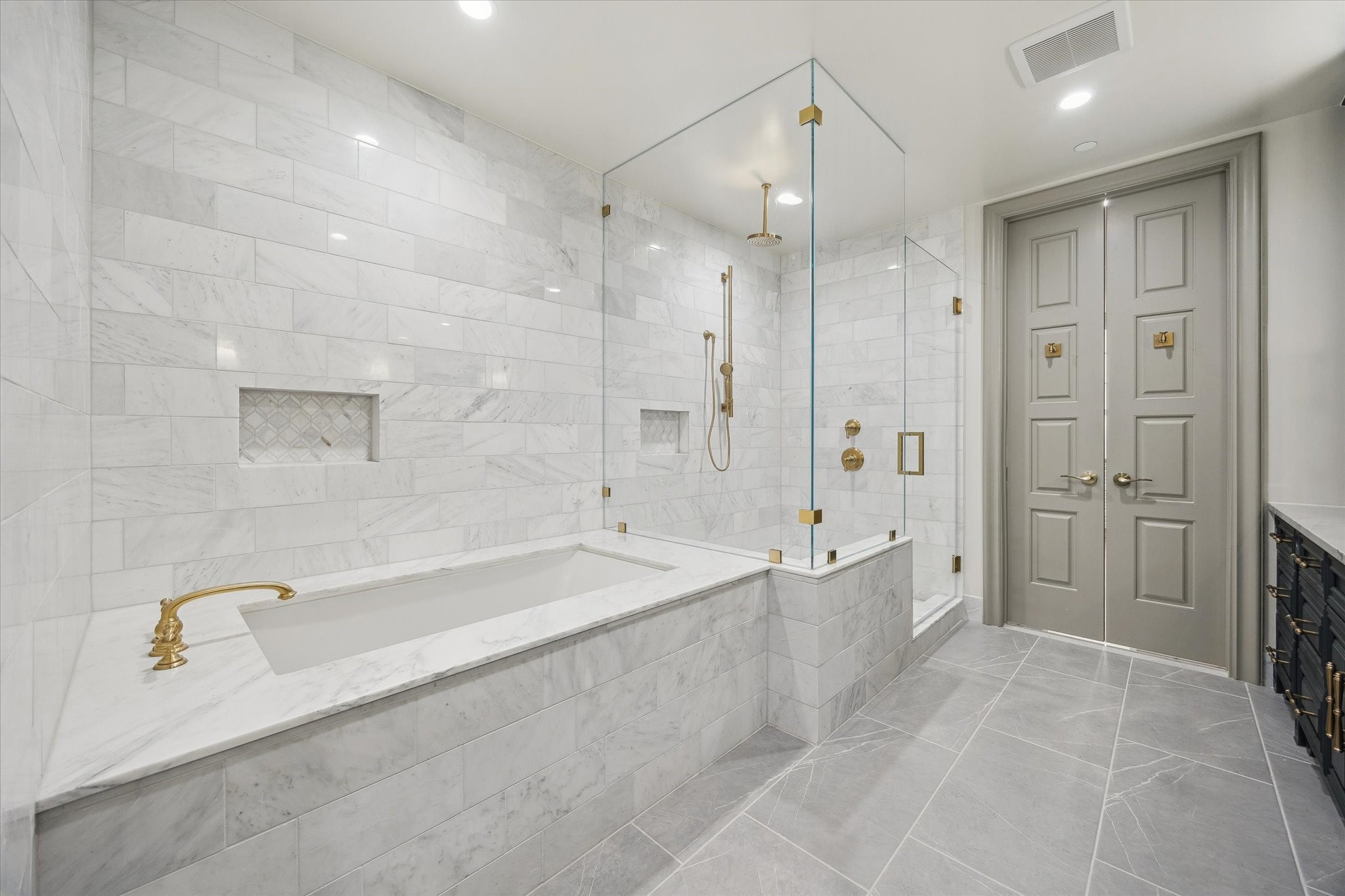 1717 Bissonnet Street, Unit 1101 Houston, TX 77005 - Photo 16 of 34 a spacious bathroom with a granite countertop tub shower and a sink