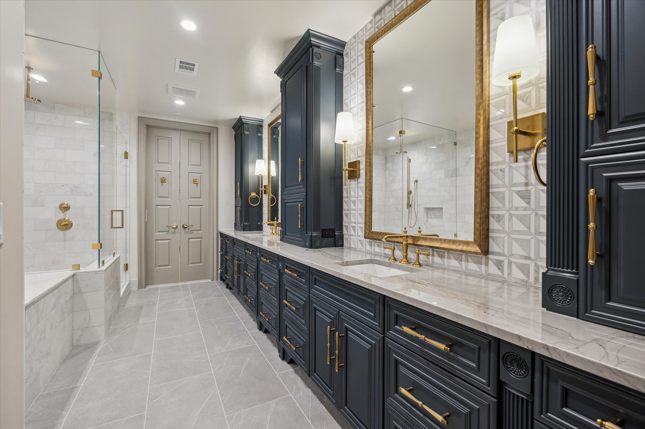 1717 Bissonnet Street, Unit 1101 Houston, TX 77005 - Photo 17 of 34 a bathroom with a double vanity sink and mirror with shower