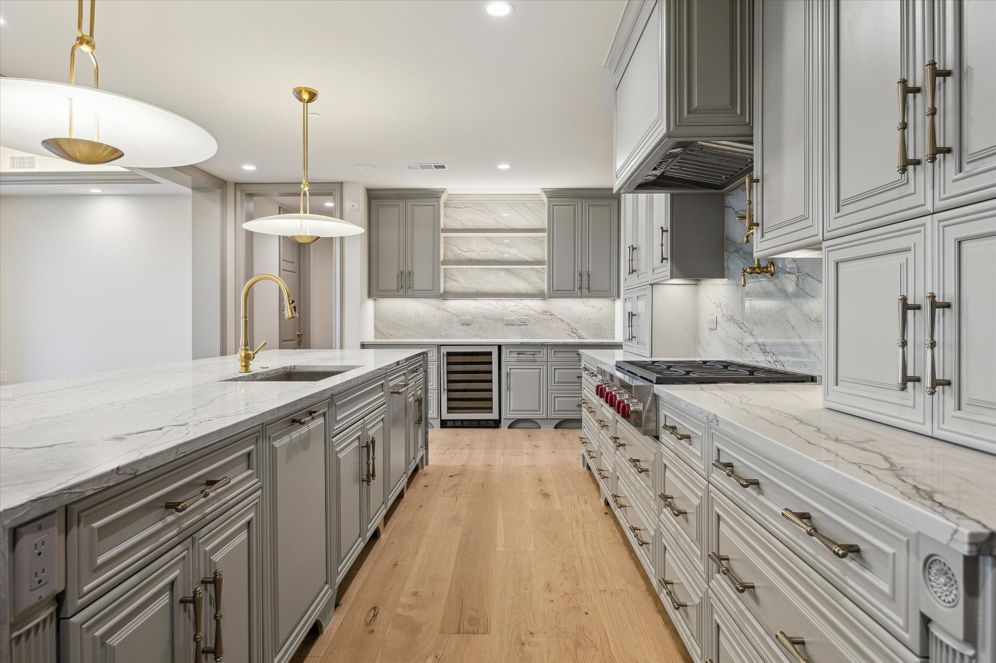 1717 Bissonnet Street, Unit 1101 Houston, TX 77005 - Photo 2 of 34 a large kitchen with stainless steel appliances granite countertop a lot of counter space and wooden floors