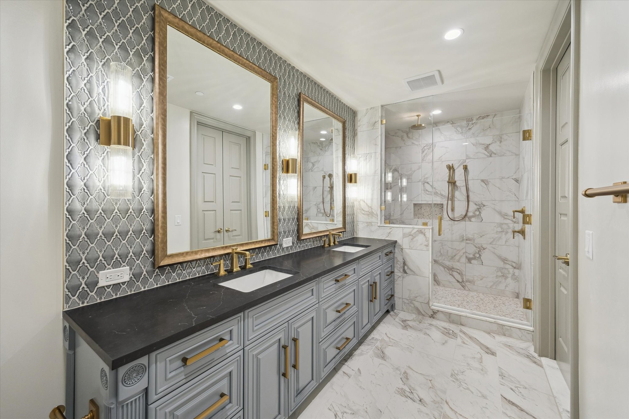 1717 Bissonnet Street, Unit 1101 Houston, TX 77005 - Photo 21 of 34 a bathroom with a double vanity sink mirror and shower