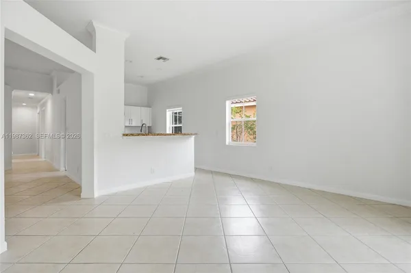 a view of kitchen with furniture and window
