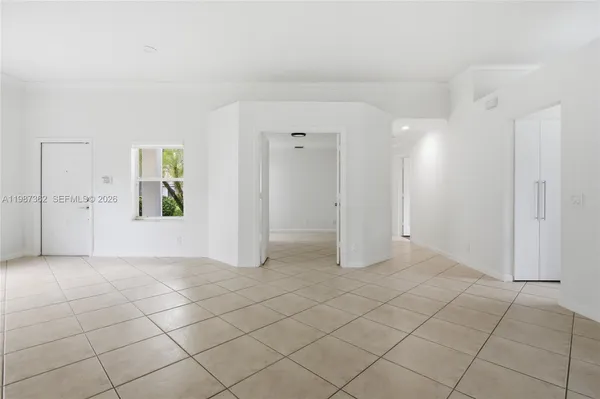 a view of a livingroom with an empty space and window