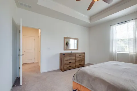 a bedroom with a bed and a dresser
