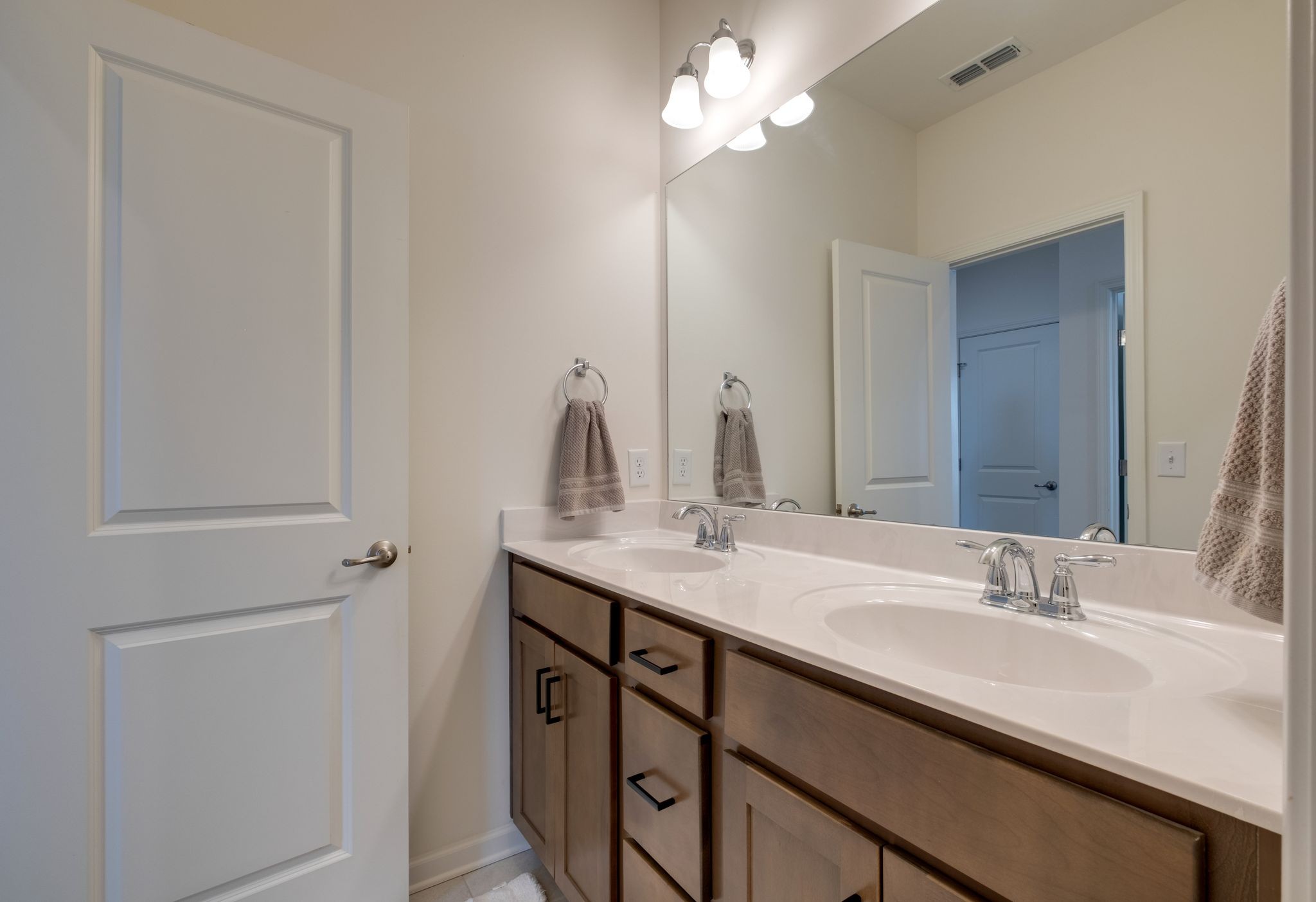 3611 Hoggett Ford Road Hermitage, TN 37076 - Photo 20 of 34 a bathroom with a sink a light fixture and a mirror