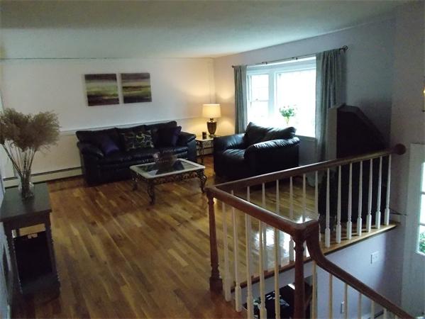 13 Winsor Road Billerica, MA 01821 - Photo 8 of 23 a living room with furniture window and a flat screen tv