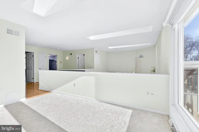 a room with wooden floor and closet