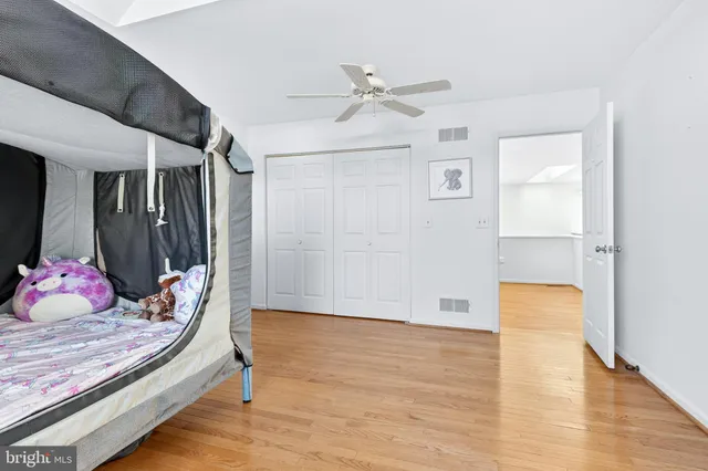 a bedroom with a large bed and a dresser