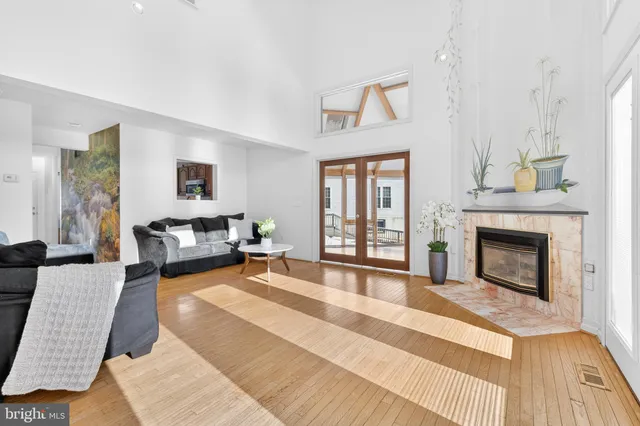 a view of a dining room with furniture wooden floor and a rug