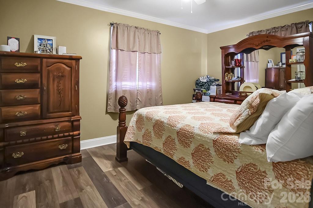 122 Rockman Road Grover, NC 28073 - Photo 14 of 45 a bedroom with a bed and wooden floor