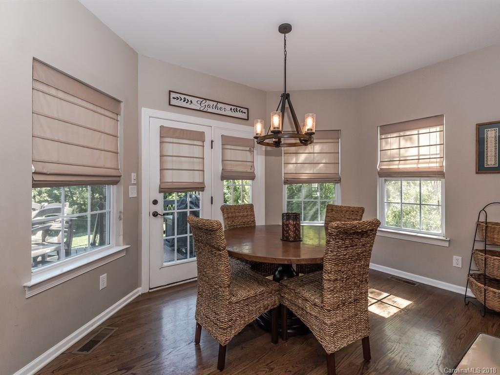 2002 Spanish Moss Road Indian Trail, NC 28079 - Photo 11 of 28 a view of a dining room with furniture window and wooden floor