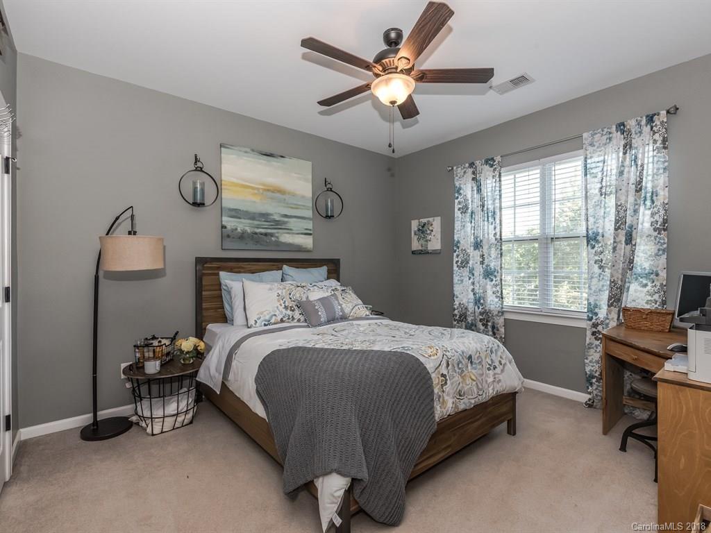 2002 Spanish Moss Road Indian Trail, NC 28079 - Photo 16 of 28 a bedroom with a bed and a window