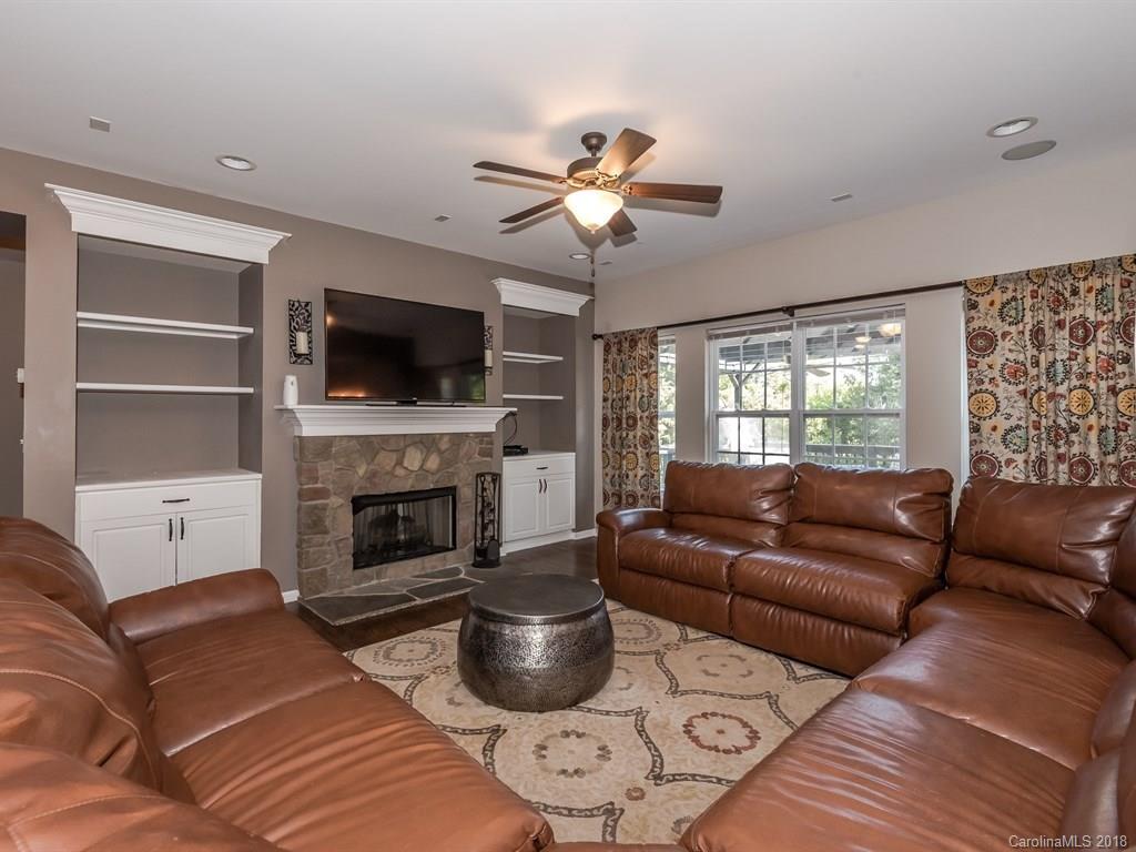 2002 Spanish Moss Road Indian Trail, NC 28079 - Photo 7 of 28 a living room with furniture a fireplace and a flat screen tv