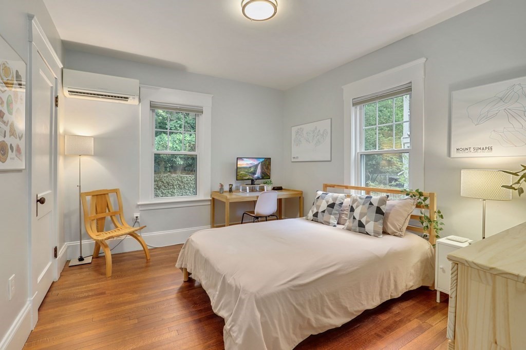 71-73 Brookley Road, Unit 1 Boston, MA 02130 - Photo 15 of 28 a bedroom with two beds and a large window