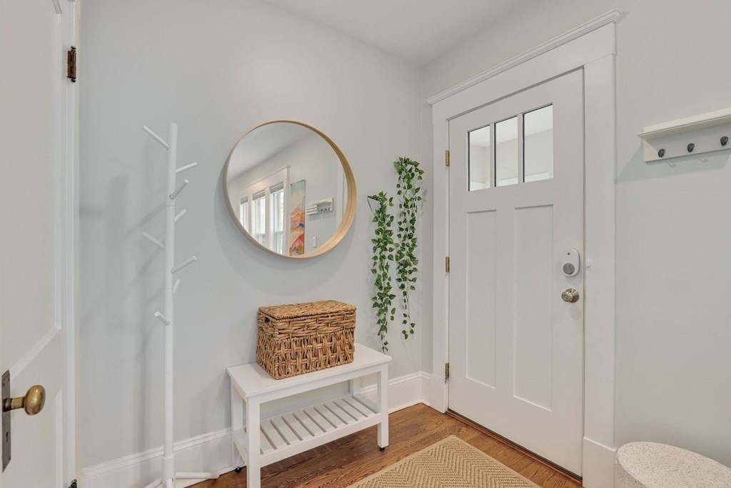 71-73 Brookley Road, Unit 1 Boston, MA 02130 - Photo 20 of 28 a view of a hallway with entryway wooden floor and front door