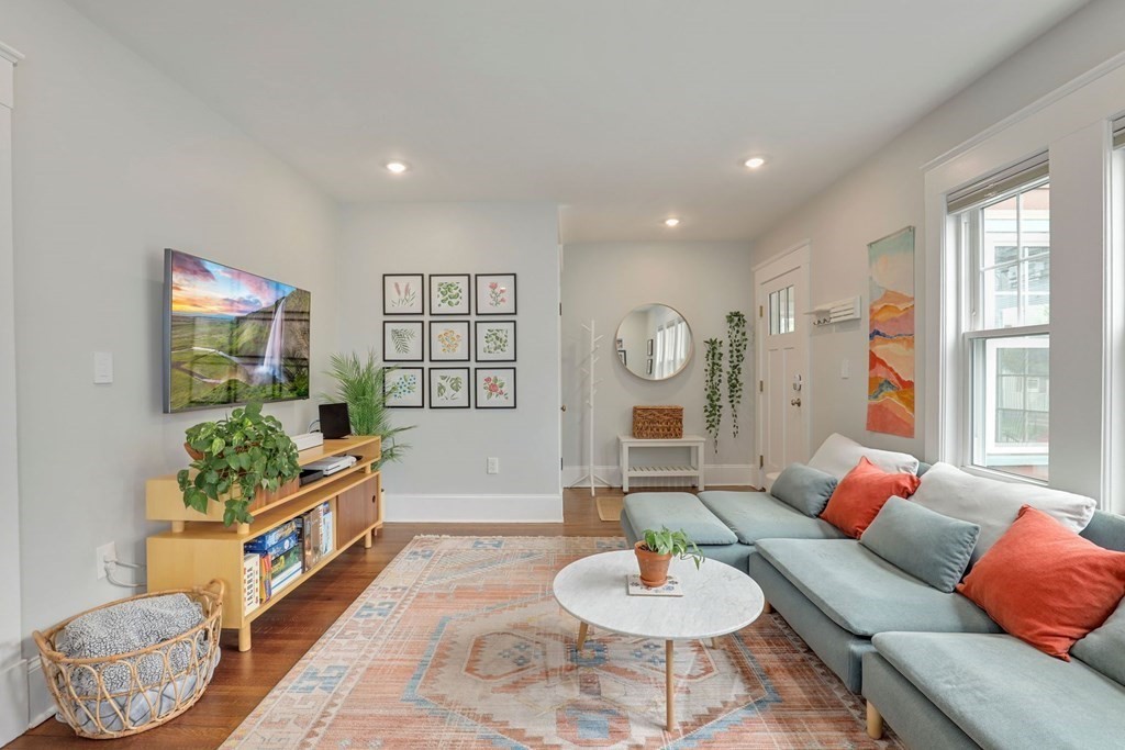 71-73 Brookley Road, Unit 1 Boston, MA 02130 - Photo 2 of 28 a living room with furniture and a wooden floor