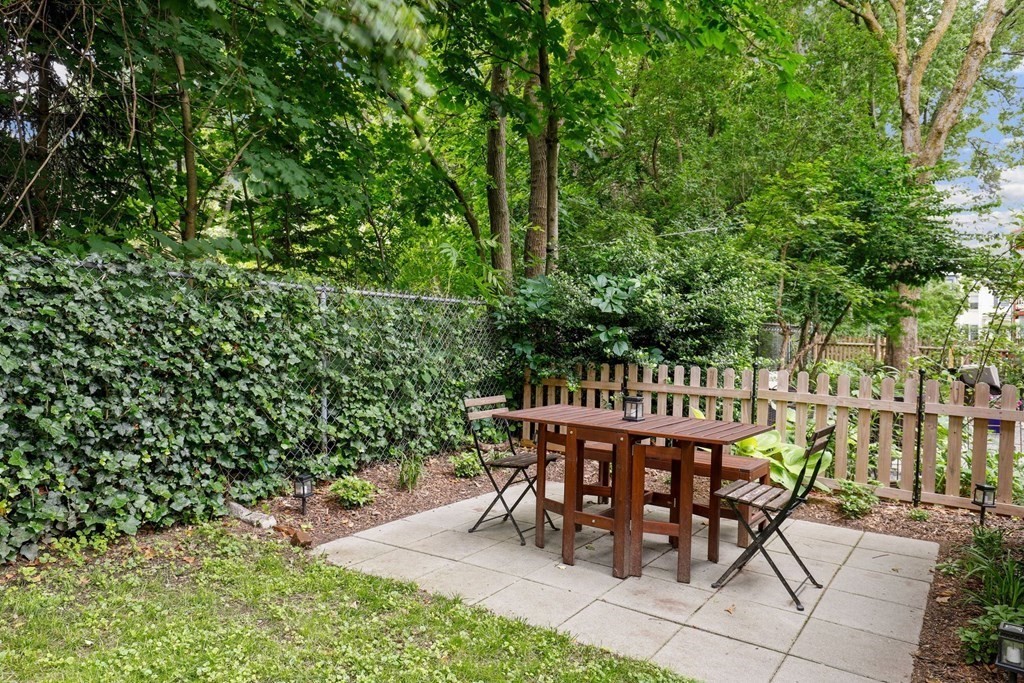 71-73 Brookley Road, Unit 1 Boston, MA 02130 - Photo 23 of 28 a view of a chairs and table in the patio