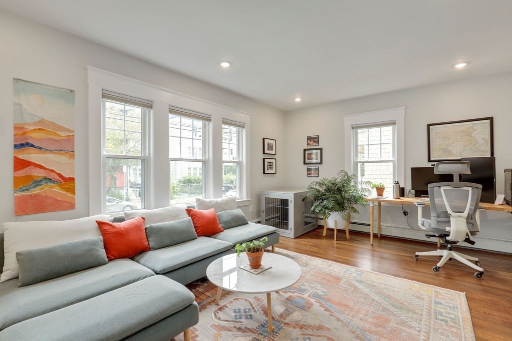 71-73 Brookley Road, Unit 1 Boston, MA 02130 - Photo 3 of 28 a living room with furniture and a large window