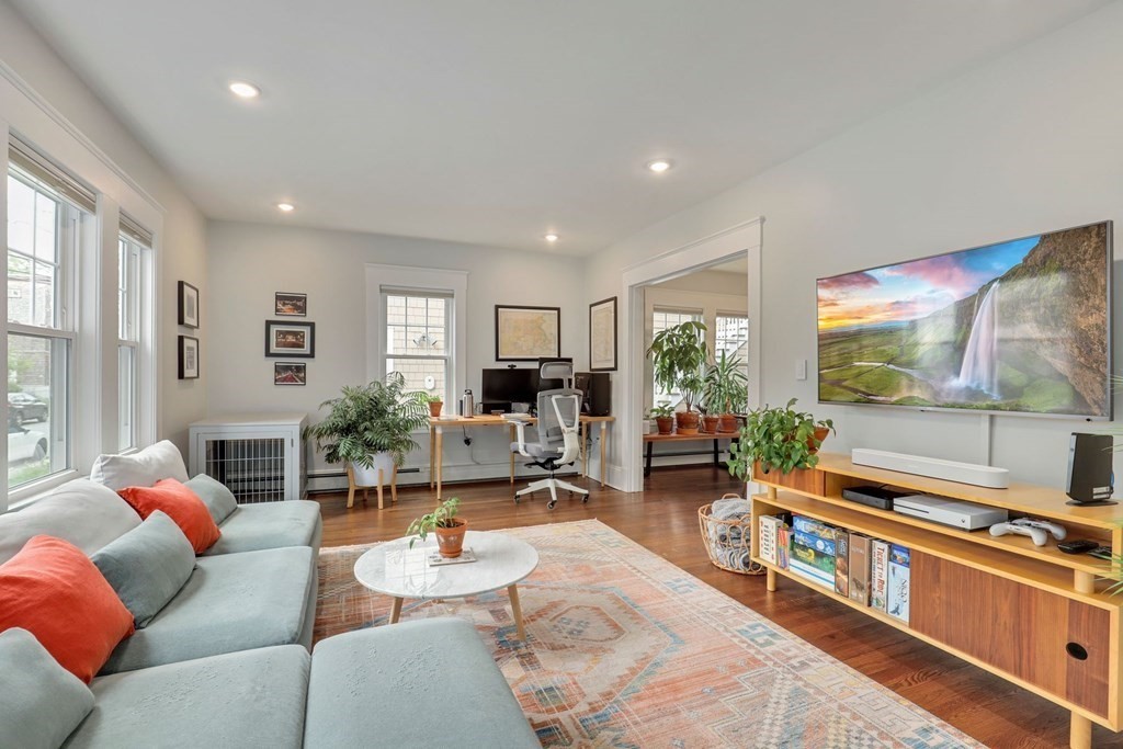 71-73 Brookley Road, Unit 1 Boston, MA 02130 - Photo 4 of 28 a living room with furniture and a flat screen tv