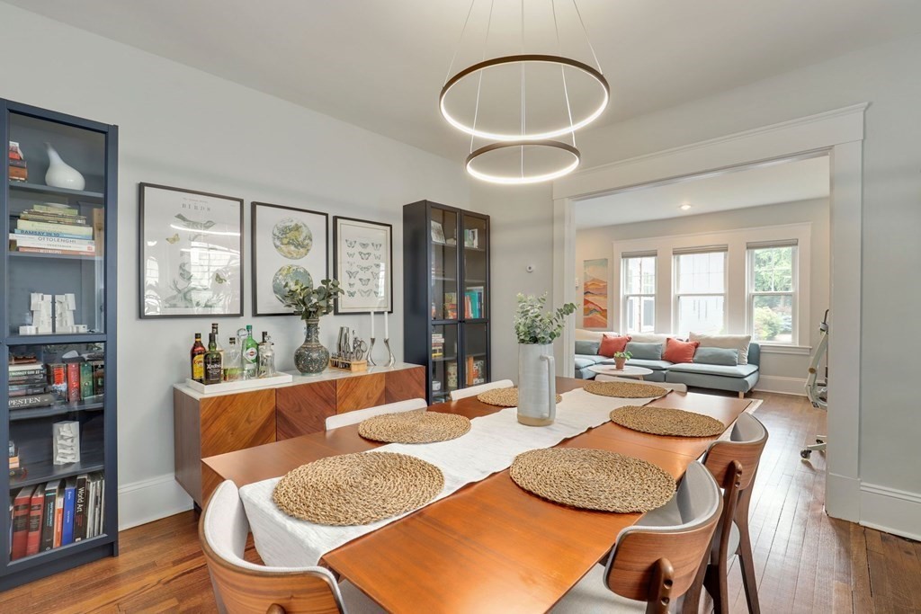 71-73 Brookley Road, Unit 1 Boston, MA 02130 - Photo 9 of 28 a dining room with furniture and wooden floor