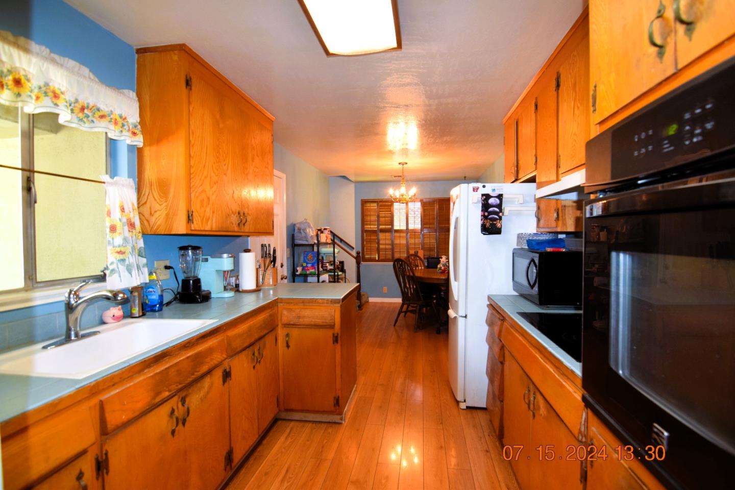 3909 Paladin Drive San Jose, CA 95124 - Photo 10 of 20 a kitchen with stainless steel appliances a sink stove and cabinets