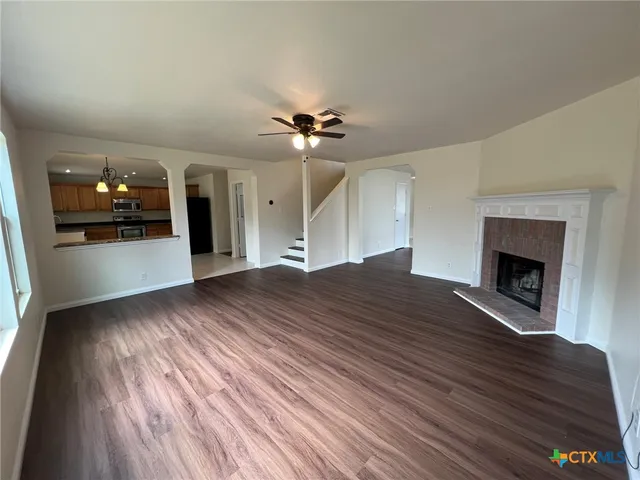 a view of a kitchen with furniture and a fireplace