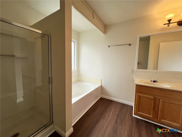 a bathroom with a bathtub and a sink